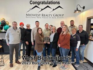 Picture of the employees of Midwest Realty and the City of West Burlington Council.